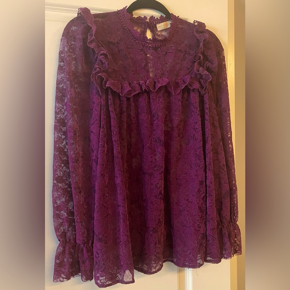 Great lace top. Never worn. It is not lined so it is see thru